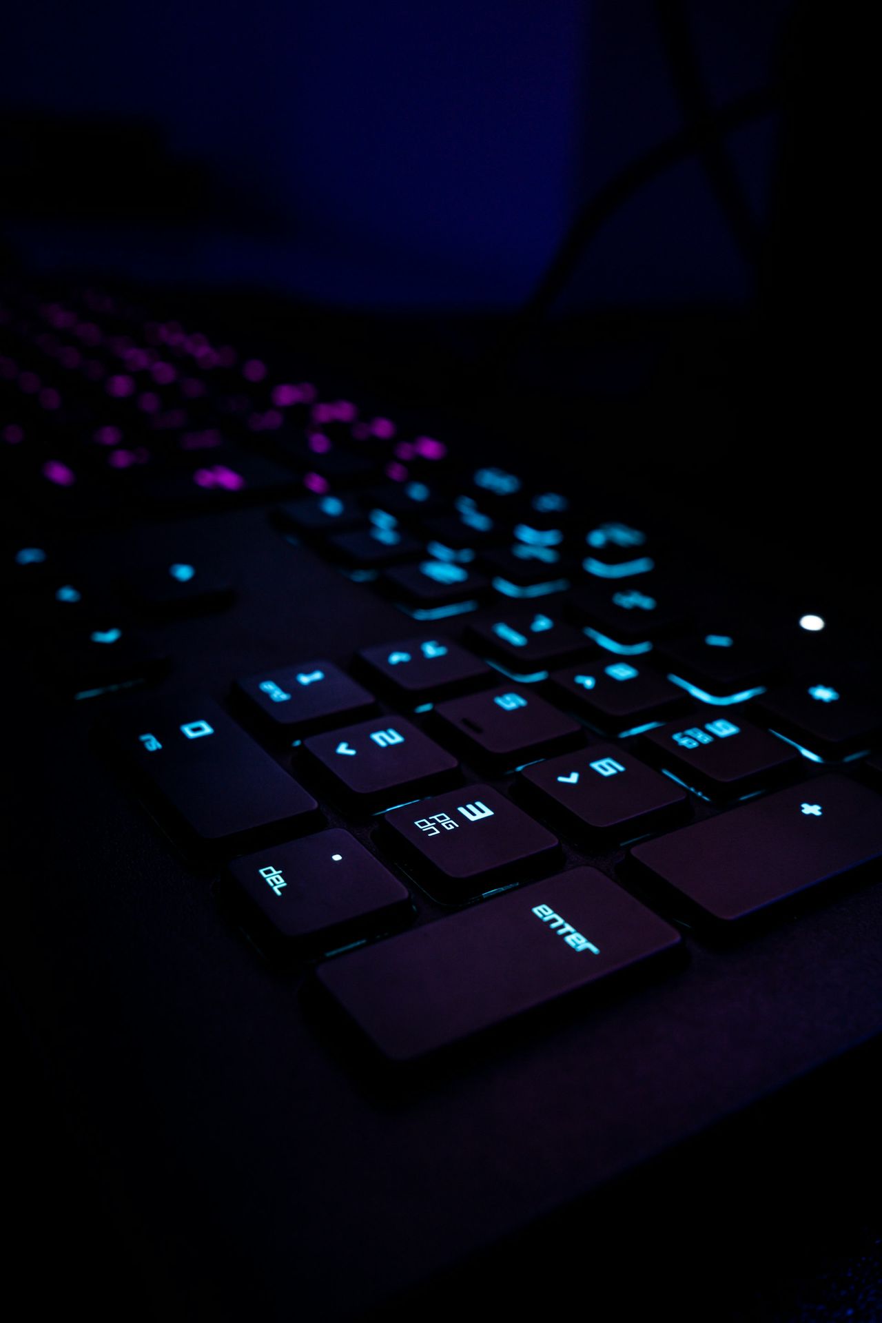 black computer keyboard on blue textile